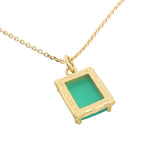 Gold necklace with textured pendant and rectangular stone