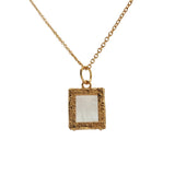 Gold necklace with textured pendant and rectangular stone