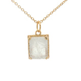 Gold necklace with textured pendant and rectangular stone