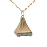 Gold necklace with bell pendant, zircons and stone