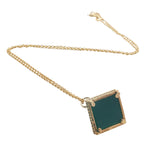 Gold necklace with bell pendant, zircons and stone