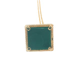 Gold necklace with bell pendant, zircons and stone