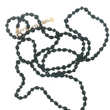 Collier doré perles noires brillantes et mates 90 cm
