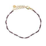 Bracelet doré grenat et noeuds bordeaux