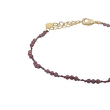 Bracelet doré grenat et noeuds bordeaux