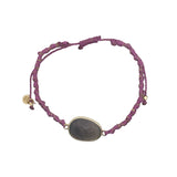 Bracelet cordon violet avec améthyste ovale cerclée de doré