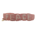 Bracelet brésilien doré fil tissé corail et crème "peace"