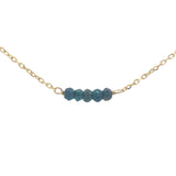 Gold choker with small natural stones