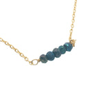 Gold choker with small natural stones