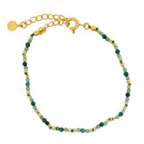 Golden bracelet with stones and golden discs