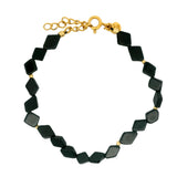 Gold bracelet with diamond-shaped stones