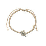 Bracelet cordon doré trèfle doré en zircons