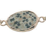 Bracelet cordon beige avec jaspe dalmatien cerclé de doré