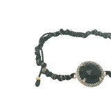 Bracelet doré cordon noir avec onyx noire ronde entourée de zircons