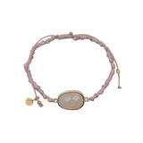 Bracelet cordon rose avec quartz rose ovale cerclé de doré
