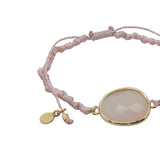 Bracelet cordon rose avec quartz rose ovale cerclé de doré