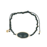 Bracelet cordon noir avec onyx noire ovale cerclée de doré