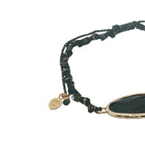 Bracelet cordon noir avec onyx noire ovale cerclée de doré