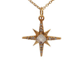 Collier doré pendentif rose des vents pierre et zircons