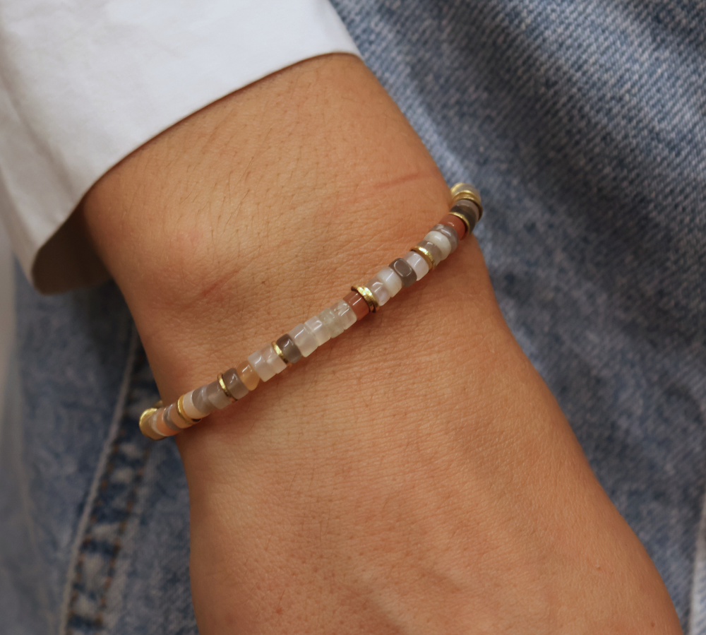 Gold bracelet and heishi stones