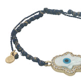 Bracelet doré cordon bleu marine main de Fatma en nacre avec oeil et zircons autour
