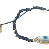 Bracelet doré cordon bleu marine oeil ovale en nacre entouré de zircons