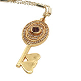 Collier doré clef tourmaline rose et zircons 60 cm