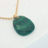 Gold necklace with faceted natural stone not set