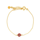 Gold bracelet and red eye