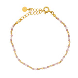 Golden bracelet with stones and golden discs