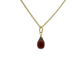 Gold necklace and faceted drop stone