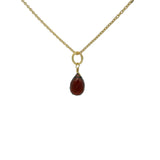 Gold necklace and faceted drop stone