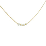 Golden necklace with natural stones and golden pearls