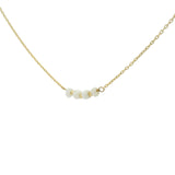 Golden necklace with natural stones and golden pearls