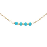 Golden necklace with natural stones and golden pearls