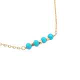 Golden necklace with natural stones and golden pearls