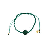 Gold cord bracelet with clover and faceted stone
