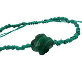 Gold cord bracelet with clover and faceted stone