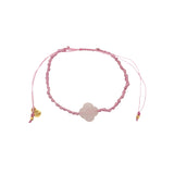 Gold cord bracelet with clover and faceted stone