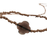 Gold cord bracelet with clover and faceted stone