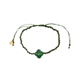 Gold cord bracelet with clover and faceted stone