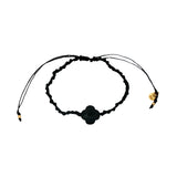 Gold cord bracelet with clover and faceted stone