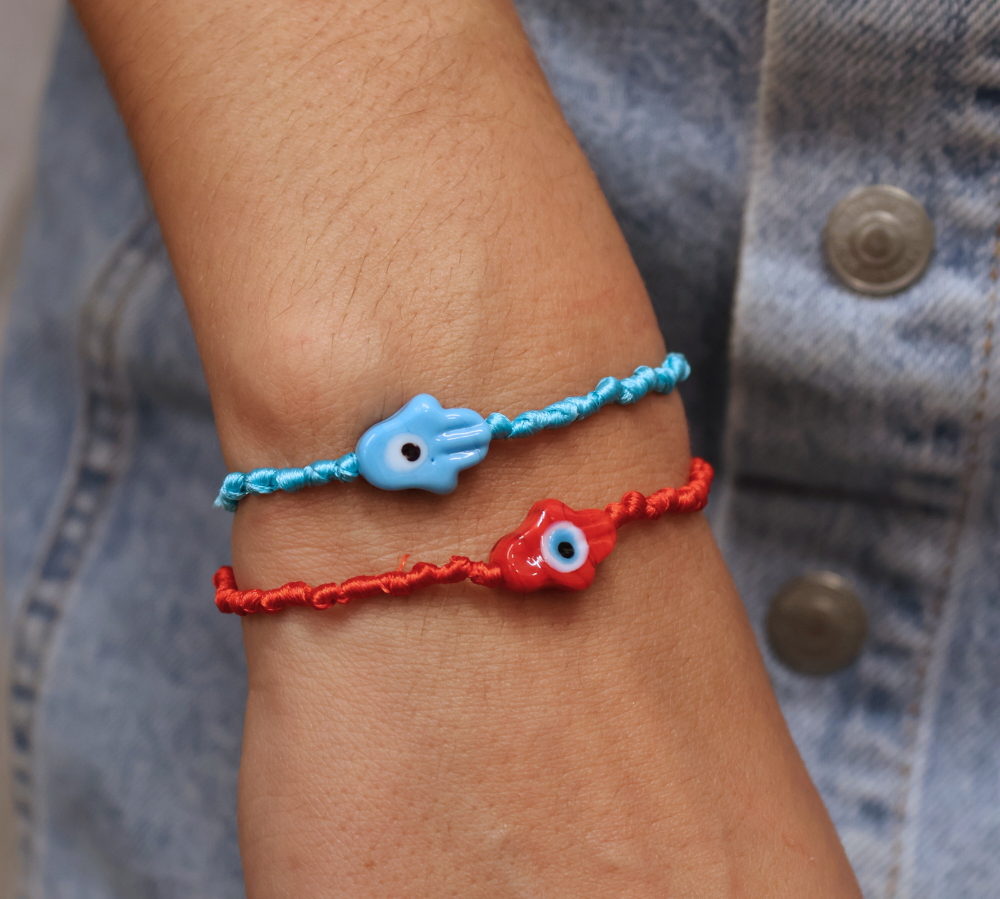 Colorful cord bracelet and blown glass hand of Fatima