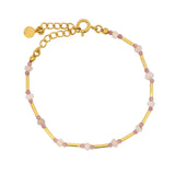Golden bracelet with tubes and faceted stones