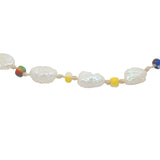 Gold necklace and stone clover