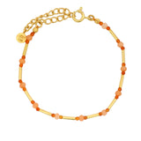 Golden bracelet with tubes and faceted stones