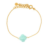 Golden clover bracelet with faceted stone