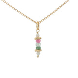 Golden necklace with stone pendant and golden balls