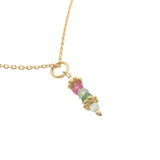 Golden necklace with stone pendant and golden balls