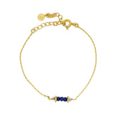 Golden bracelet with small stones and golden balls